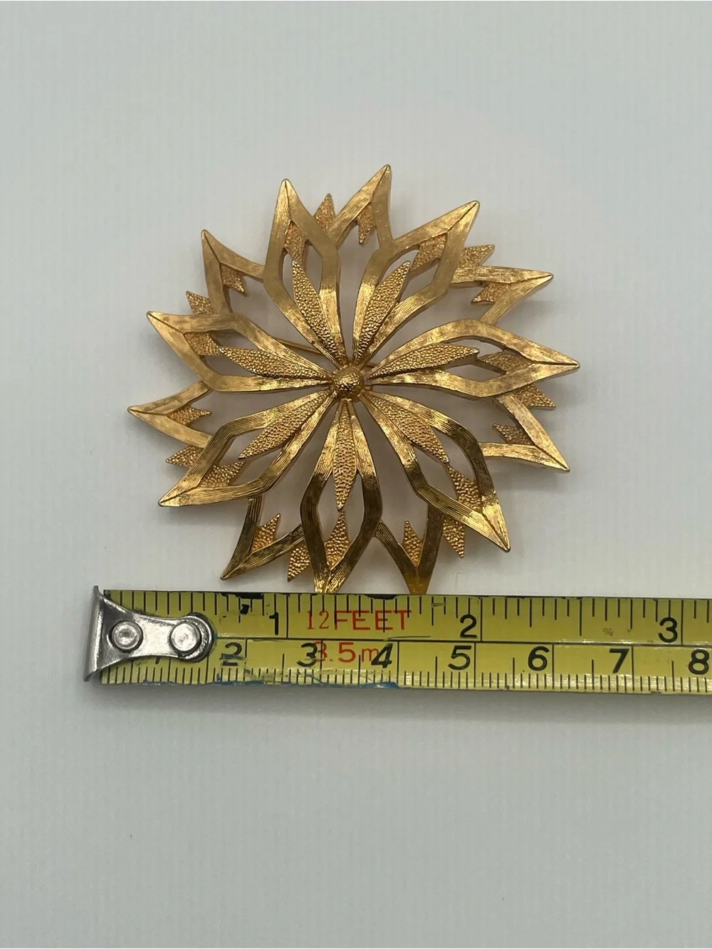 VTG Monet Gold Tone Starburst Floral Textured Brooch